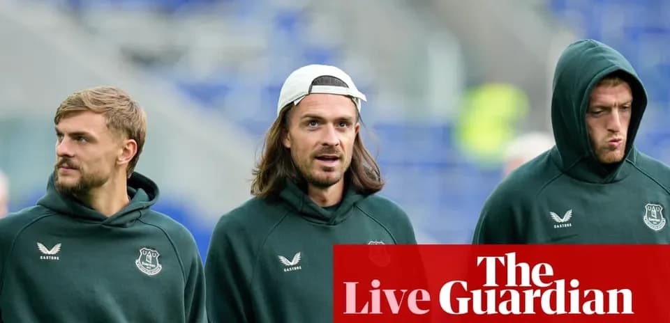 Three football players in Everton hoodies walking