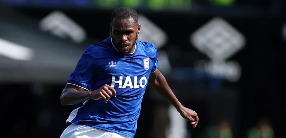 Player running in blue kit during match