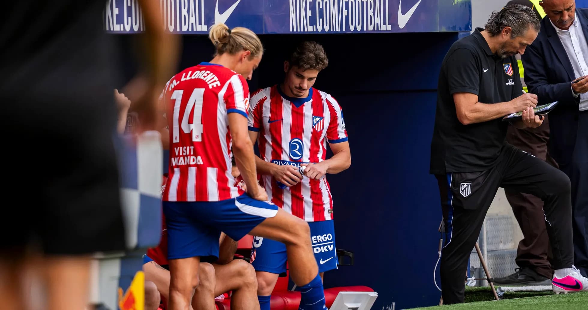Atletico Madrid players and staff on the bench