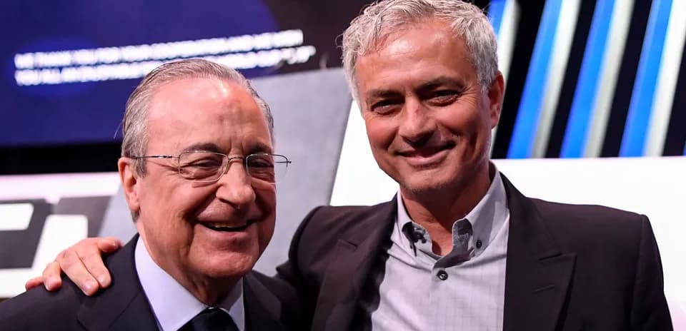 Two men smiling at an event on stage