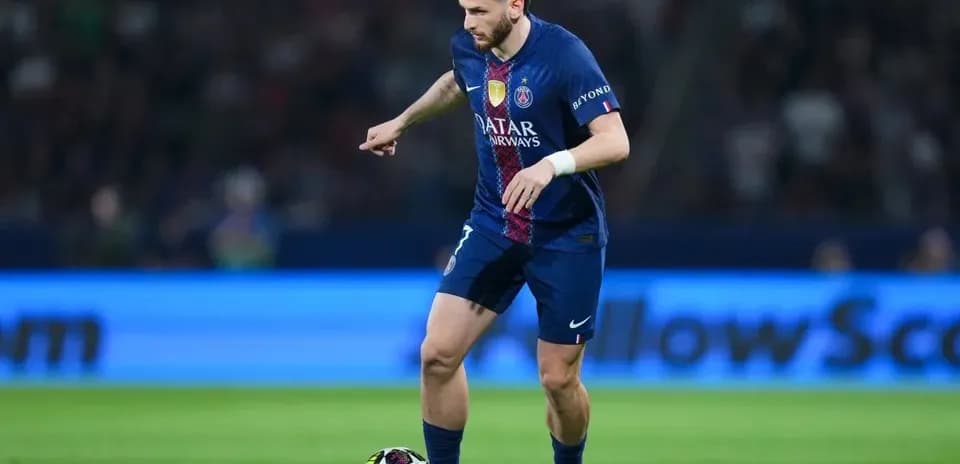 Player dribbling ball during match for PSG