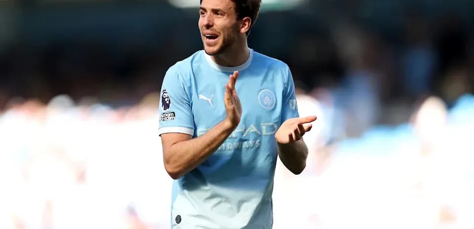 Player applauding fans during a match