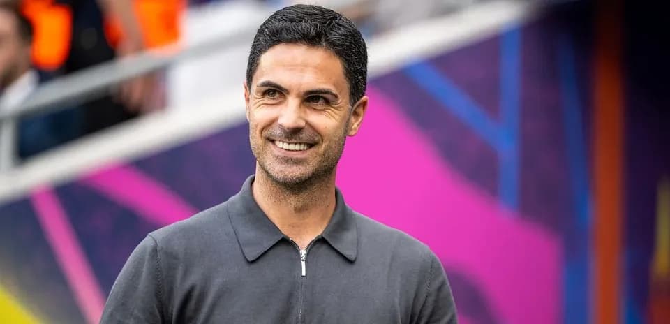 Coach smiling during a match day event