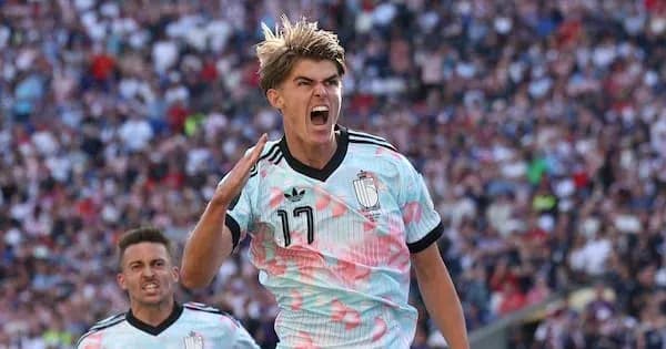 Player celebrating goal with teammates during match