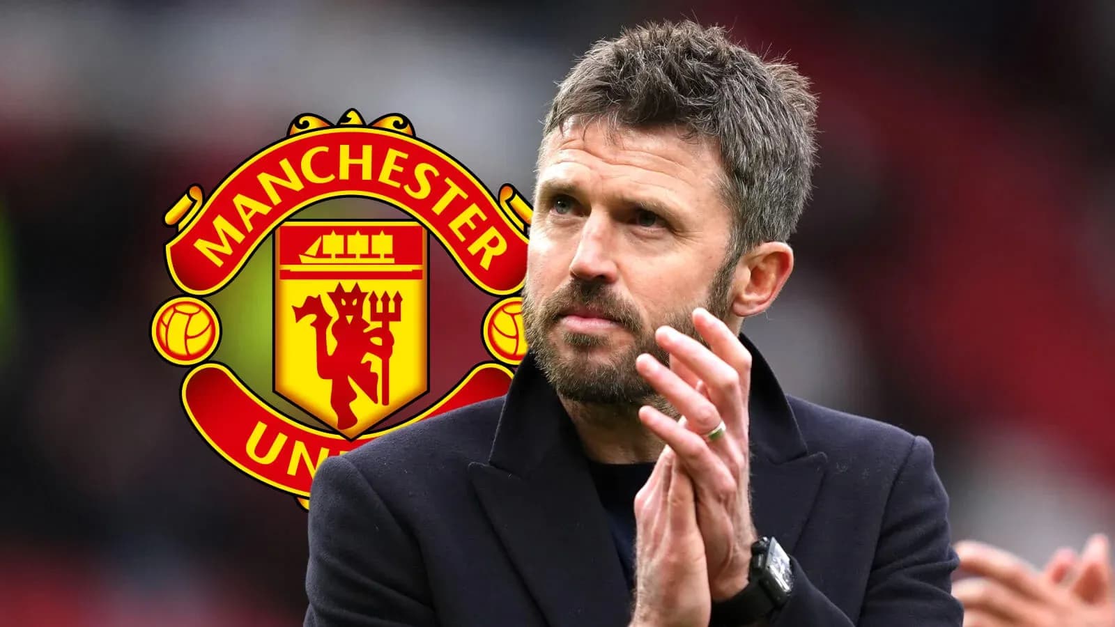 Coach applauding with Manchester United logo in background