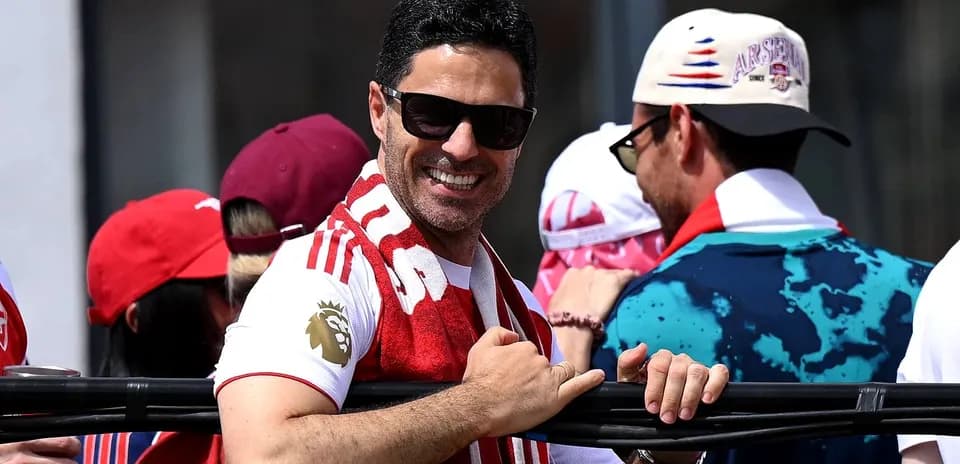 Man smiling and wearing sunglasses at event