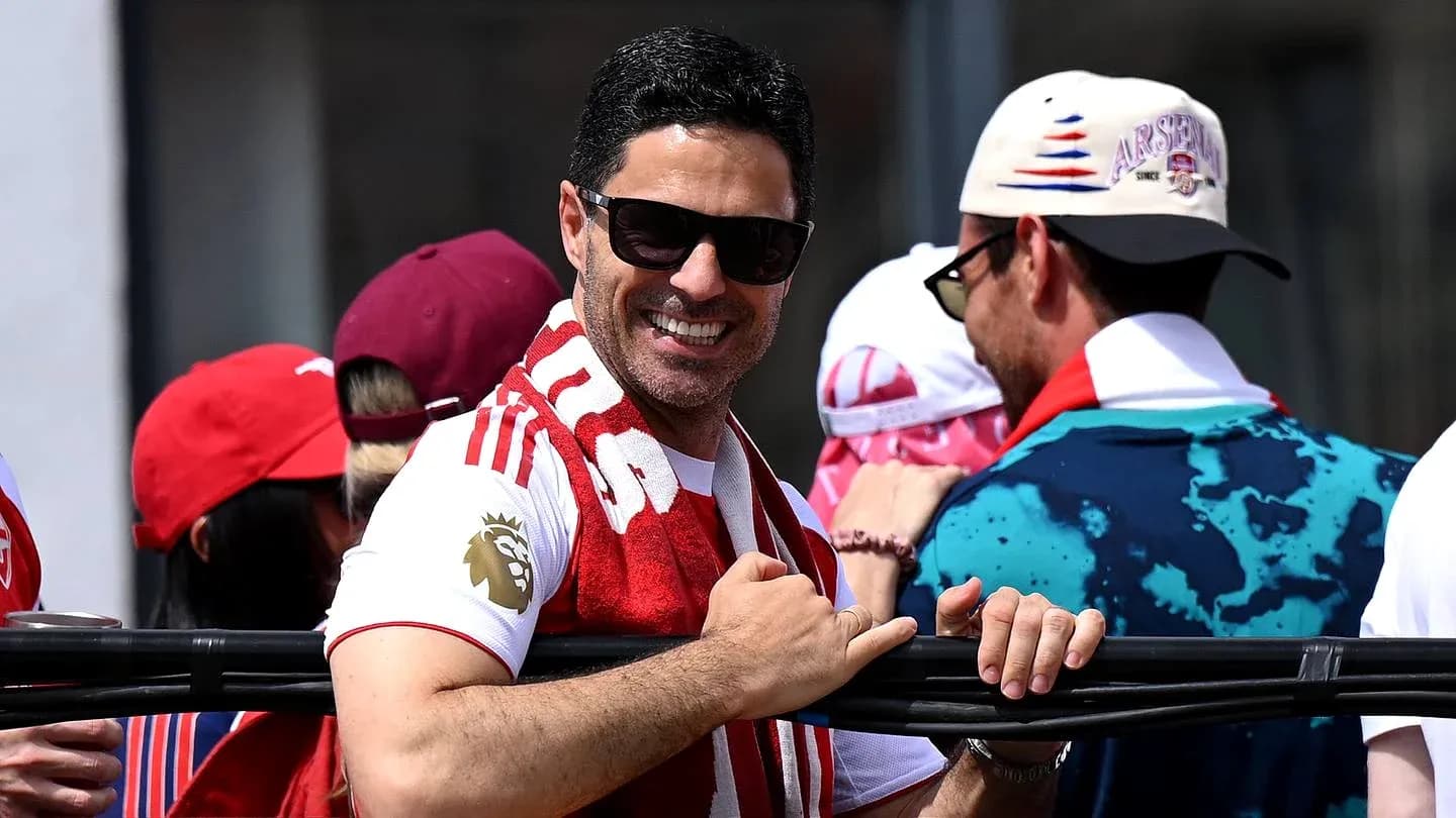 Man smiling and wearing sunglasses at event