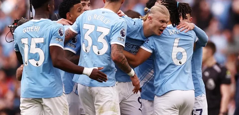 Manchester City players celebrating a goal