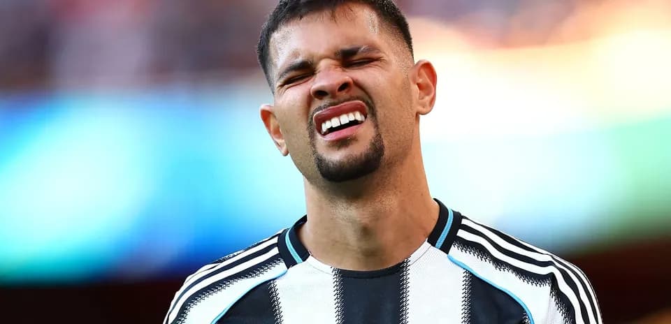 Player grimacing during a football match
