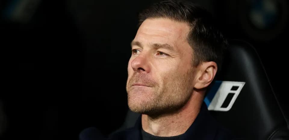 Coach seated on bench during match observation