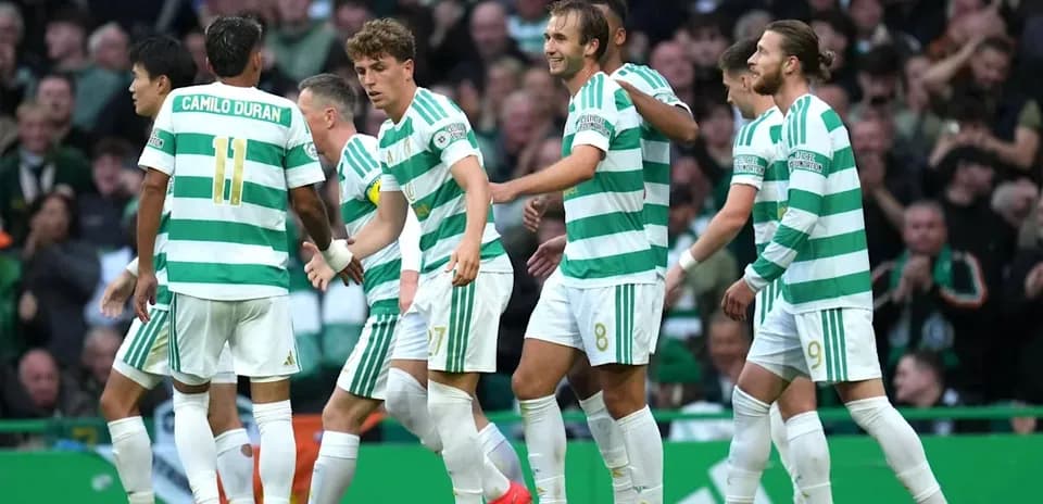 Celtic players celebrating a goal during match