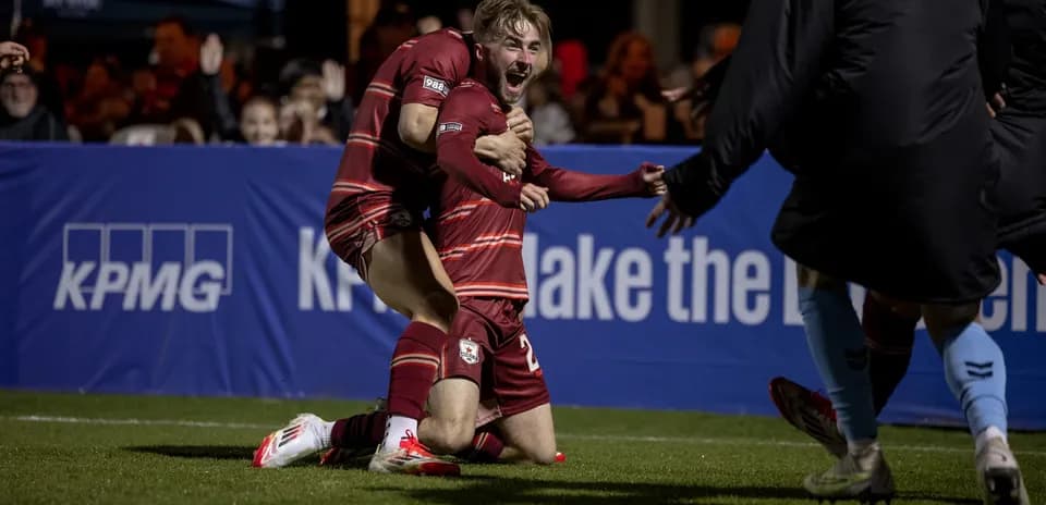 Players celebrating after scoring a goal
