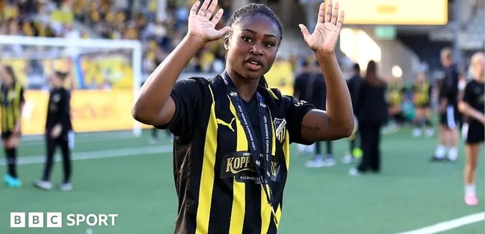 Player waving on the field after a match