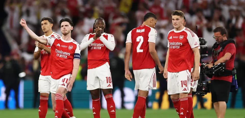 Arsenal players on field after match celebration