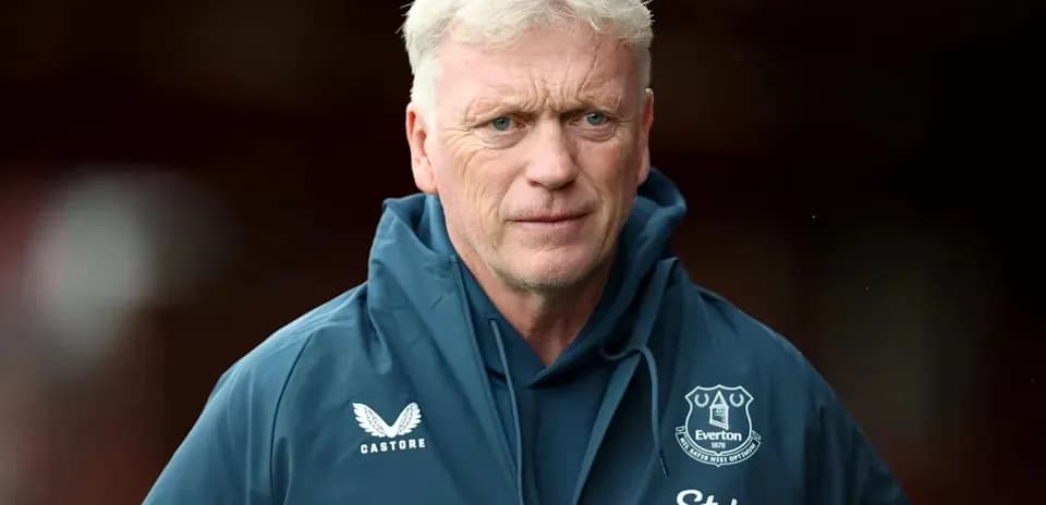 Manager wearing Everton jacket before match