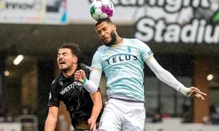 Pacific FC player heading the ball against Cavalry FC