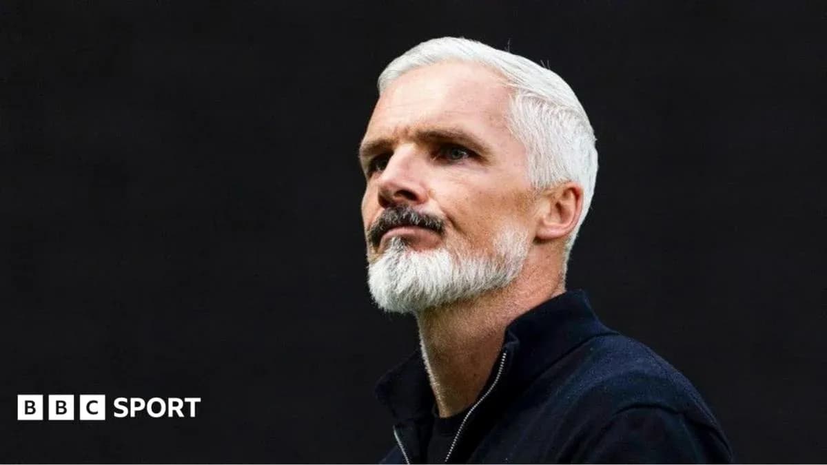 Man with silver hair and beard looking thoughtfully