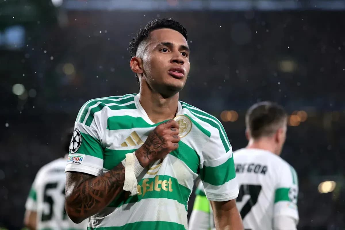 Player celebrating in Celtic jersey during match