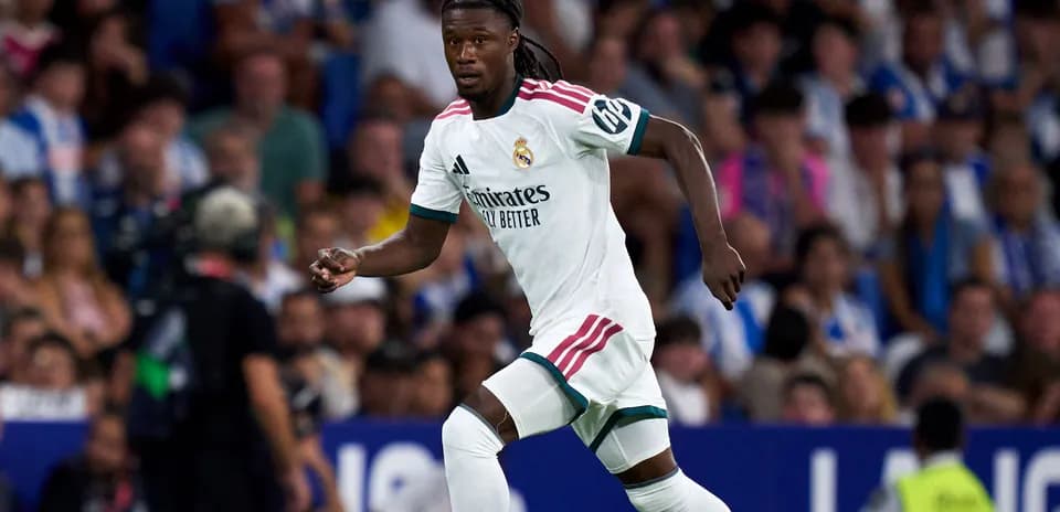Player in Real Madrid kit running on the field