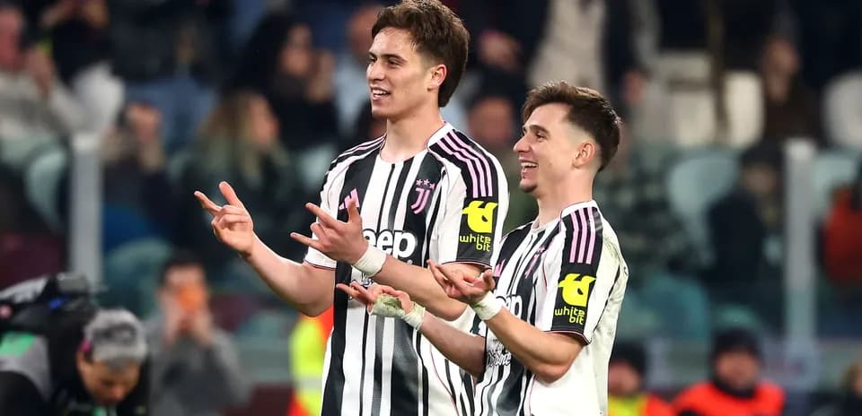 Two Juventus players celebrating on the field