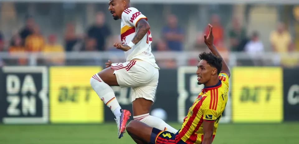Player tackling during Lecce vs AS Roma match