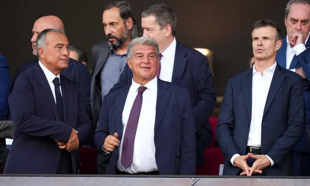 Group of executives watching match from VIP box
