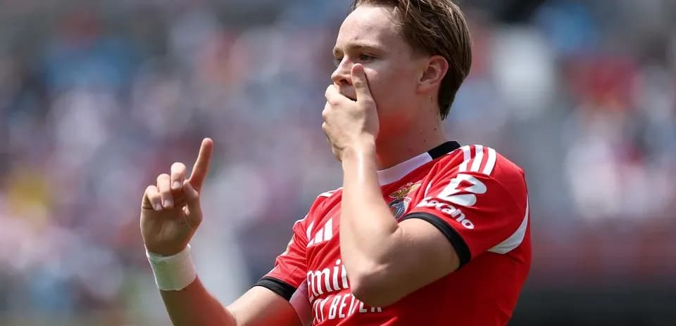 Player celebrating with finger raised after goal