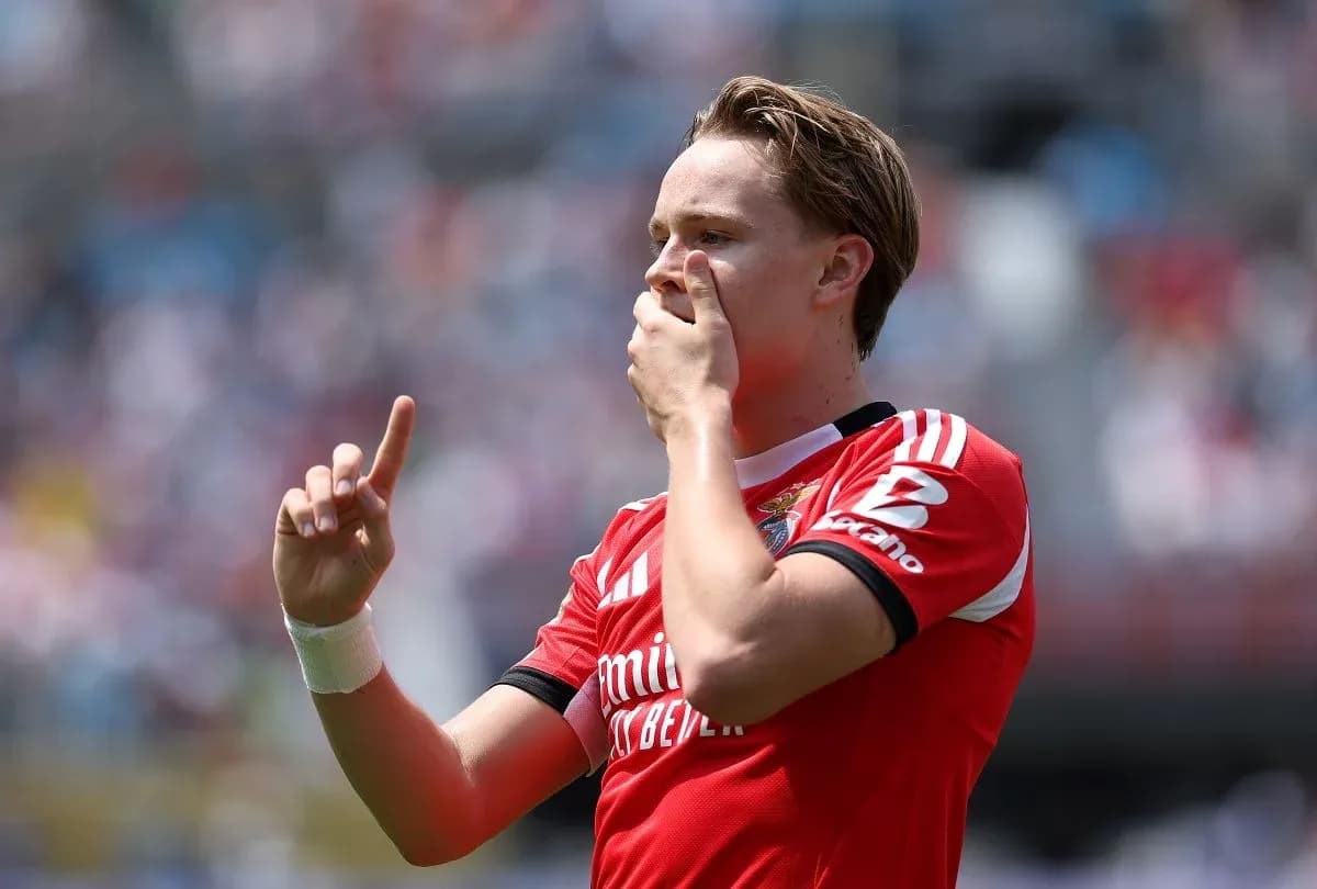 Player celebrating with finger raised after goal