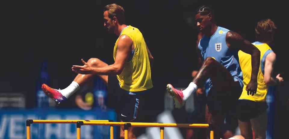 Players training with hurdles during practice session
