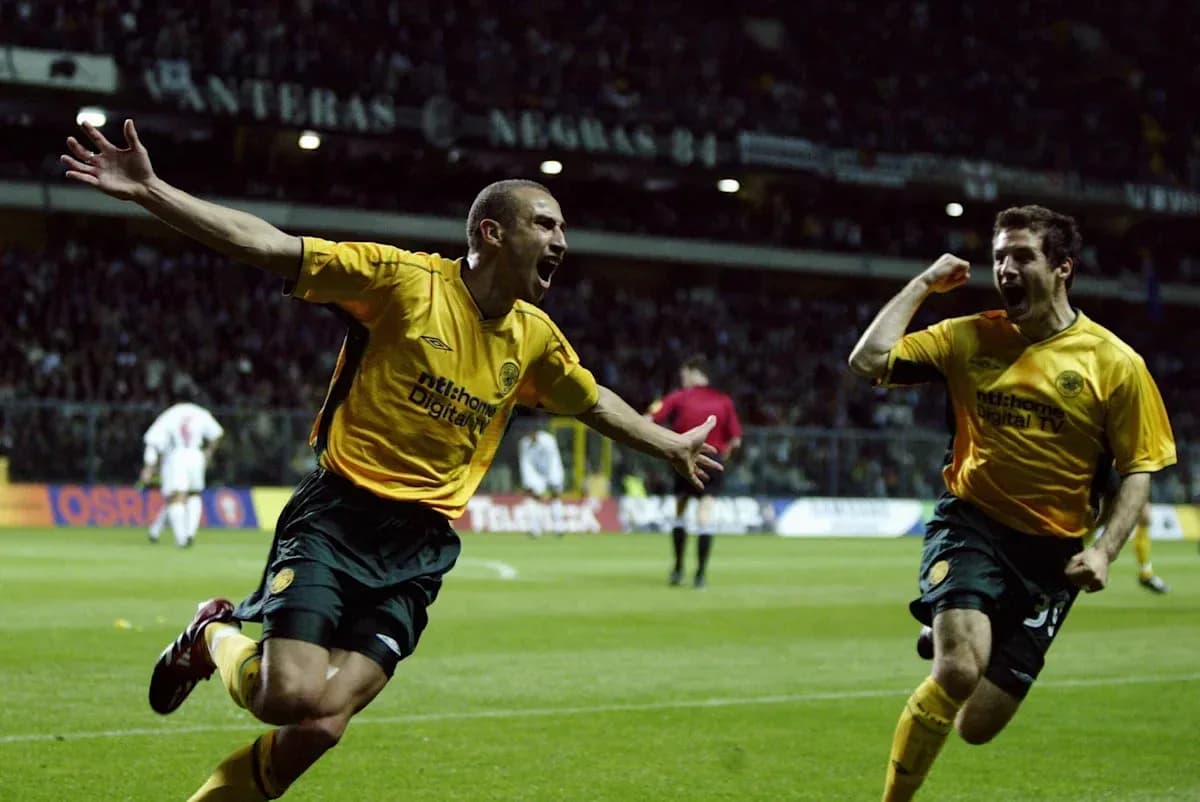 Two players celebrating a goal on the field