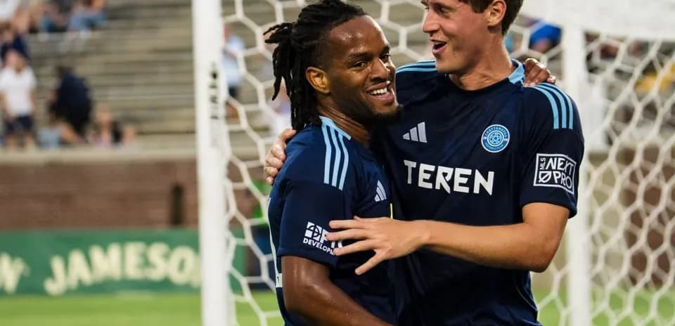 Players celebrating a goal during MLS Next Pro match