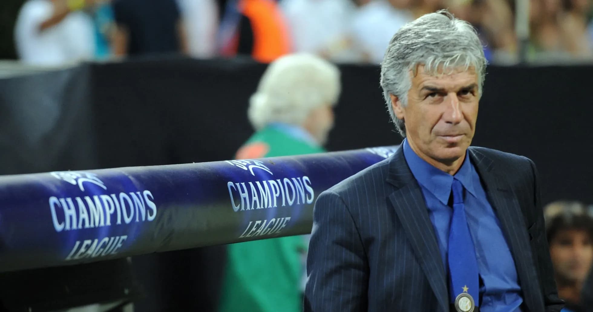 Coach observing from the sidelines during match