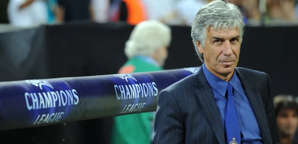 Coach observing from the sidelines during match