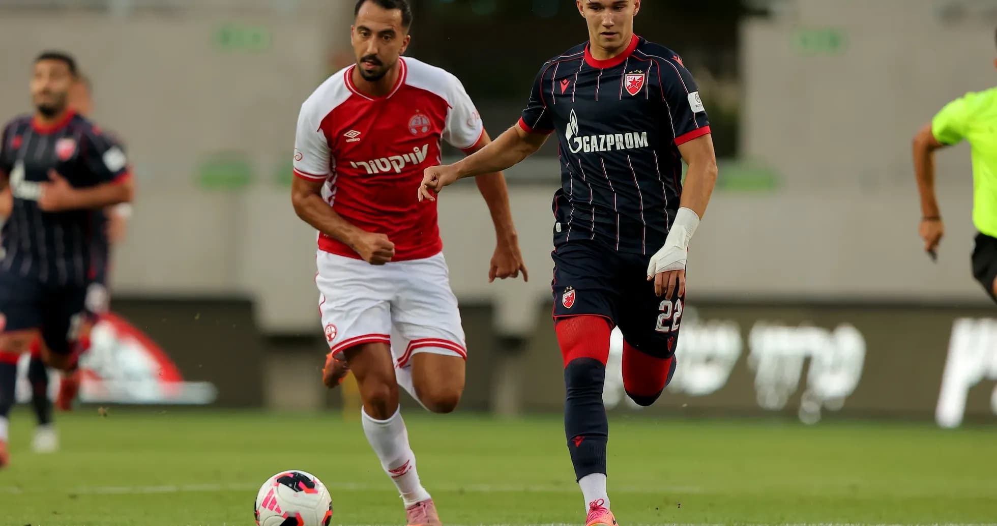 FK Crvena Zvezda player dribbling against opponent