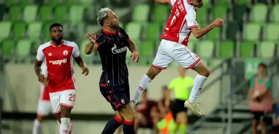 FK Crvena Zvezda player jumping for the ball