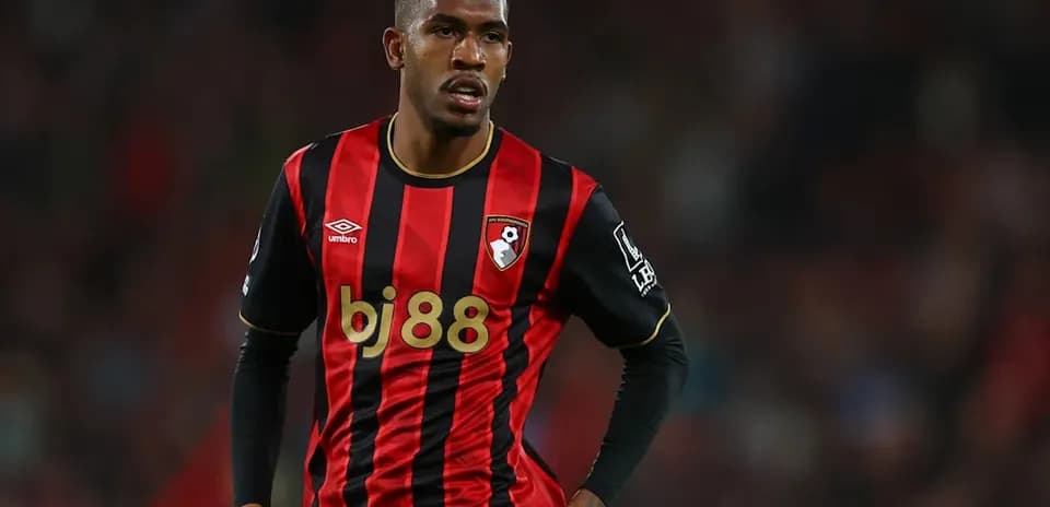 Bournemouth player in black and red jersey during match