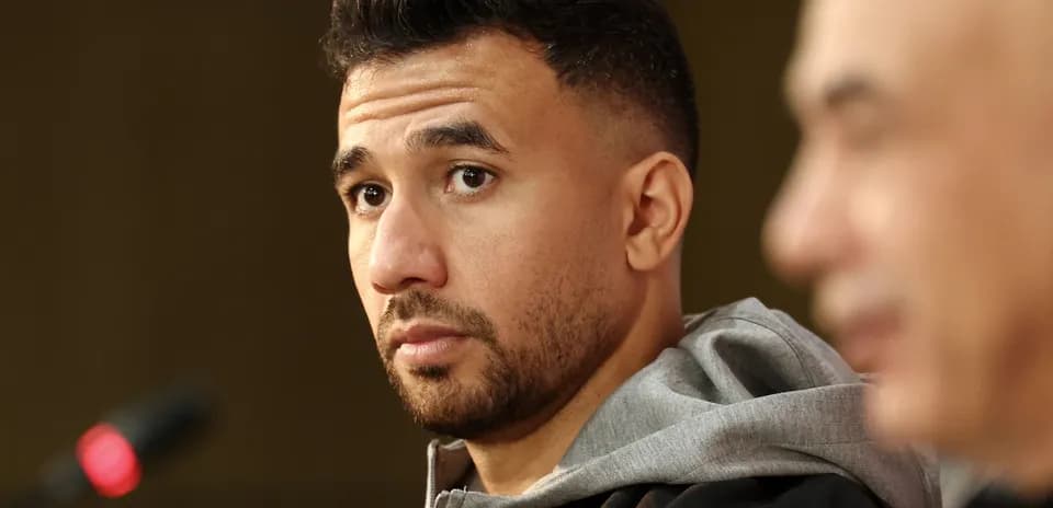 Athlete at press conference with microphone in view