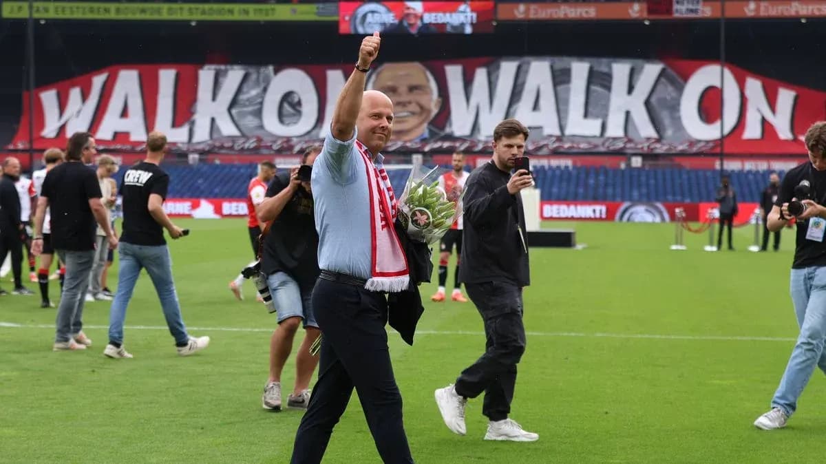 Man waving with flowers during stadium celebration