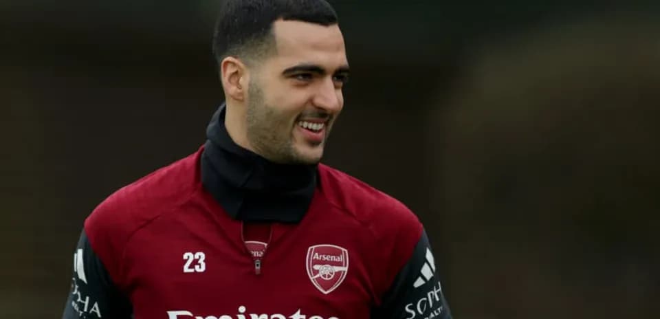 Player smiling during Arsenal training session