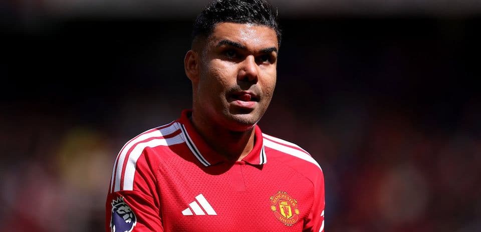 Player wearing Manchester United jersey on field