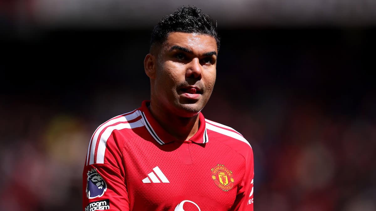 Player wearing Manchester United jersey on field