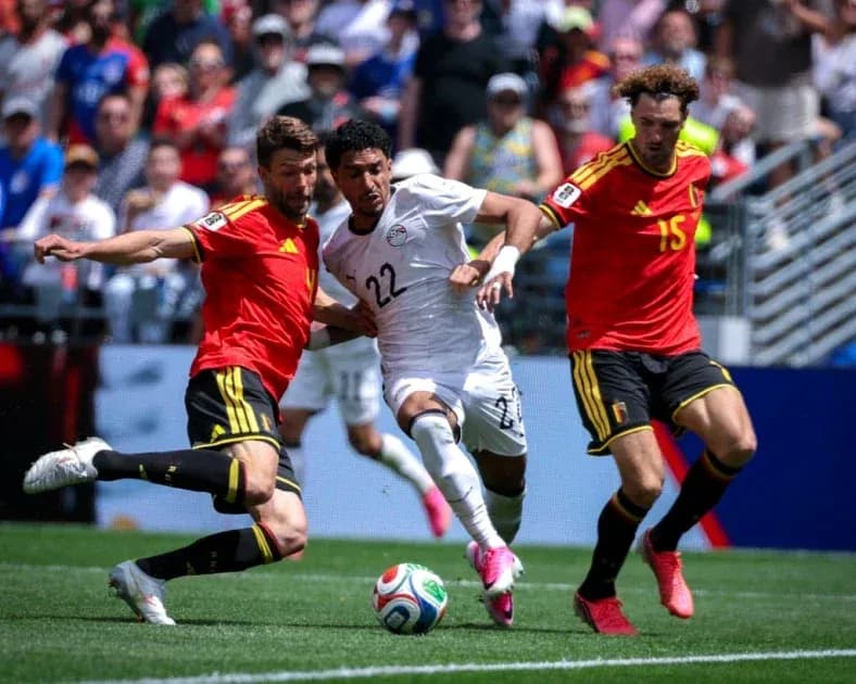 Players from Egypt and Belgium contesting for the ball