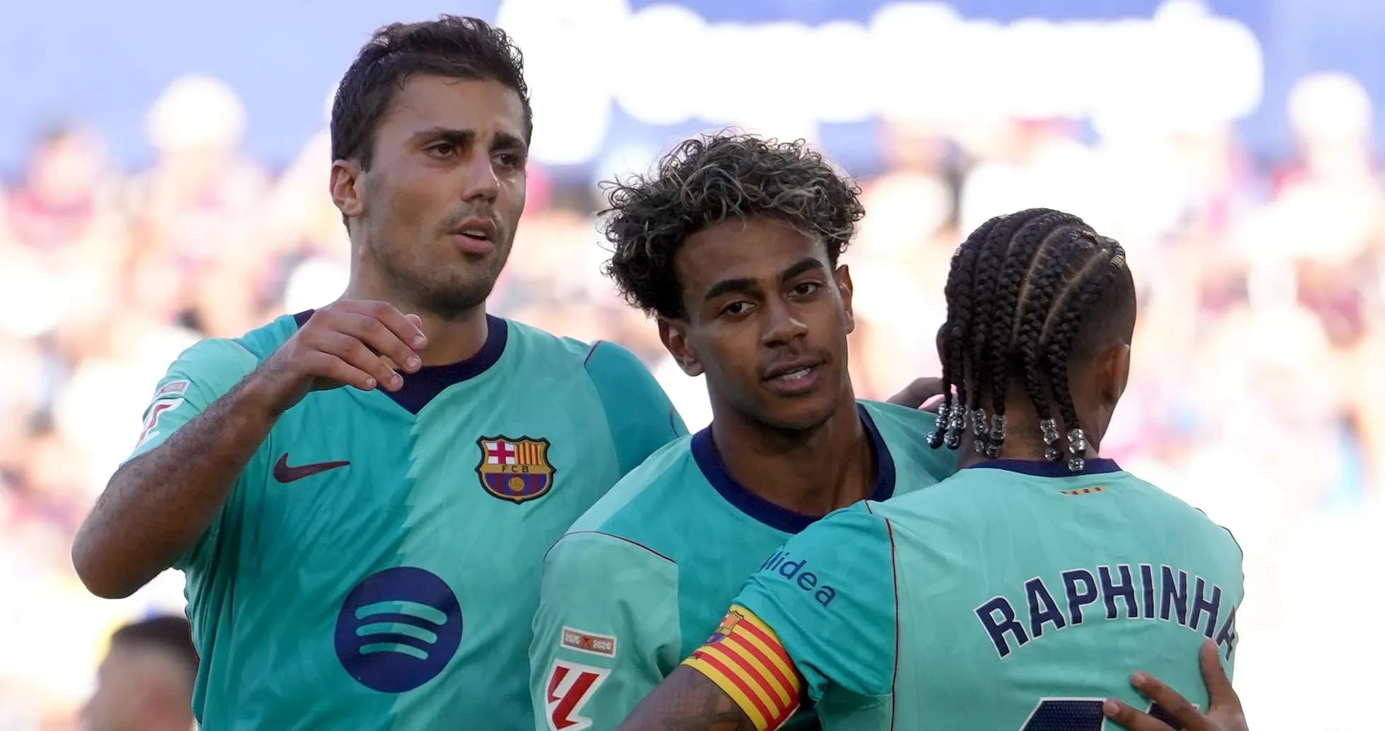Barcelona players celebrating a goal on the field