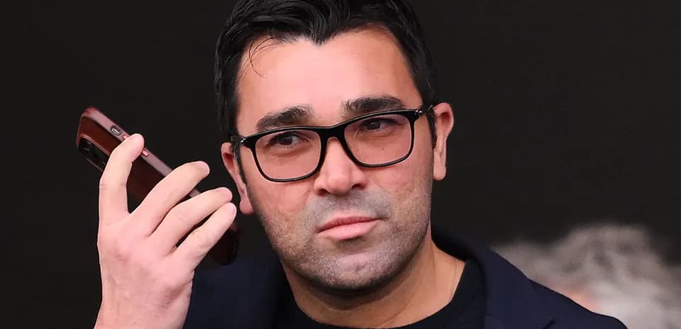 Person holding a phone, looking intently