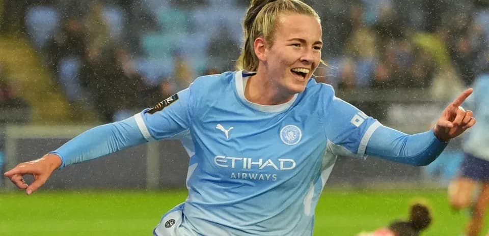 Player celebrating after scoring a goal for Manchester City