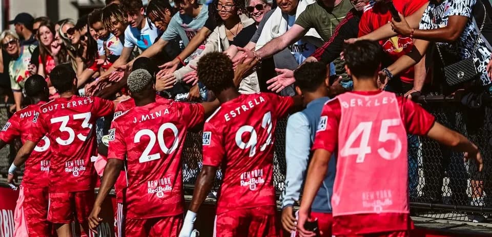 Players celebrating with fans after match