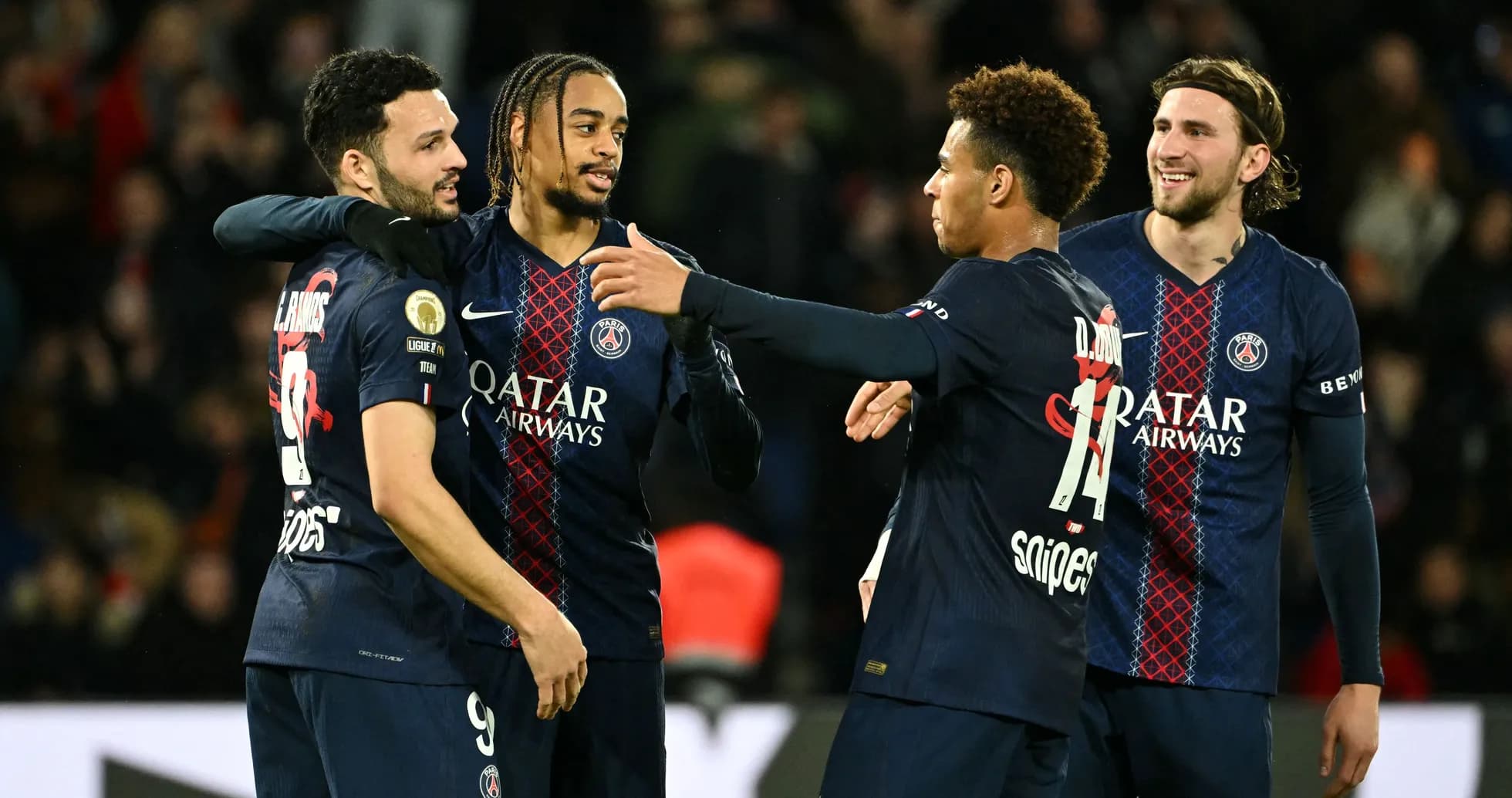 PSG players celebrating a goal on the pitch