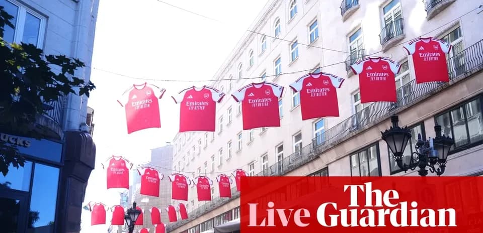 Arsenal jerseys hanging across a street