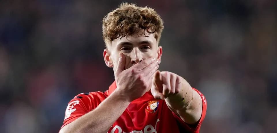 Player celebrating and pointing during match action