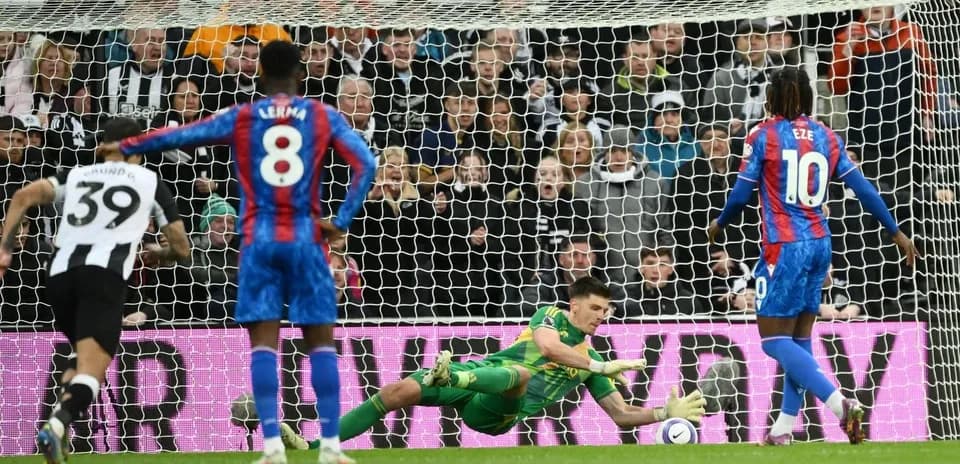 Goalkeeper saves penalty during Premier League match